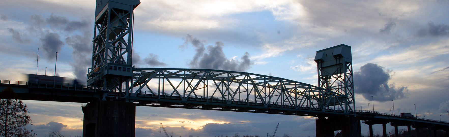 Cape Fear Memorial Bridge silhouetted at dusk.